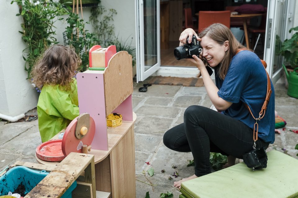 Johanna King photographing a family