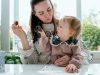 Mother and her daughter having a snack during a documentary family photography session in Enniskerry
