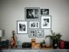 Wall display of framed black and white family photos