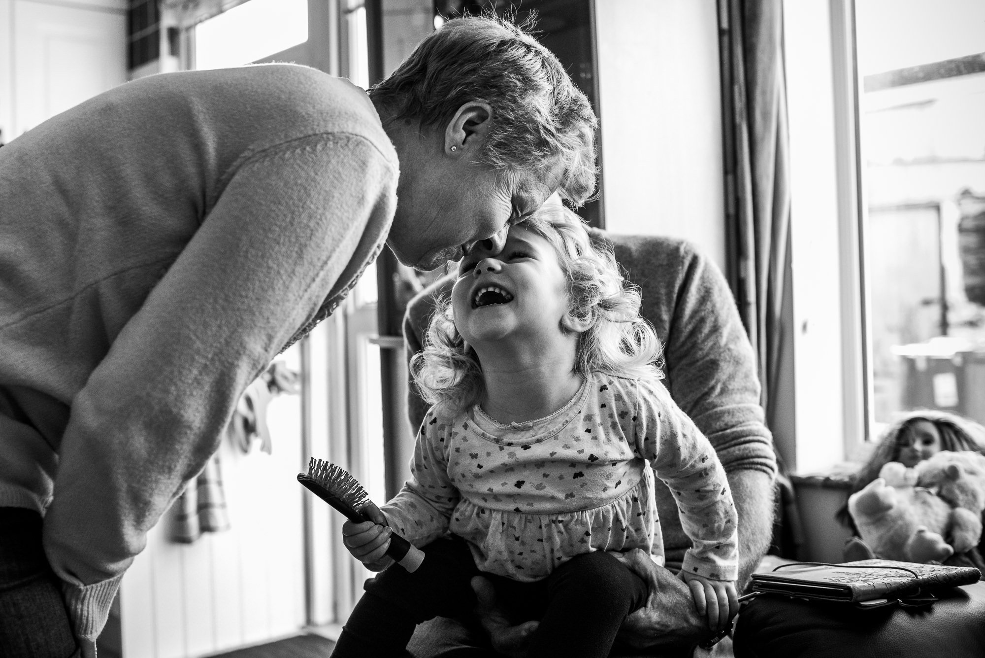 Grandparent and child sharing joyful moment indoors
