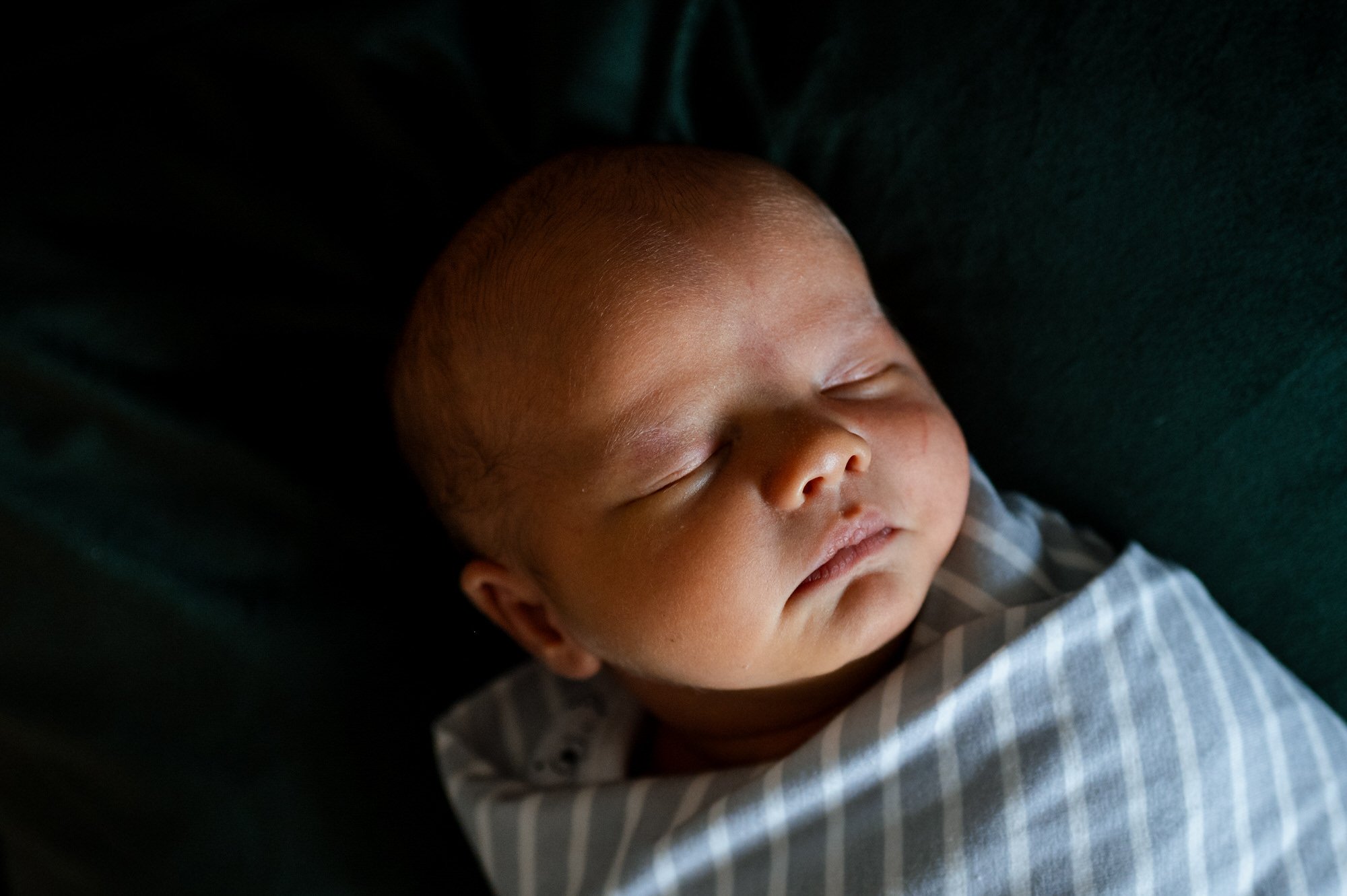 Newborn baby peacefully sleeping.
